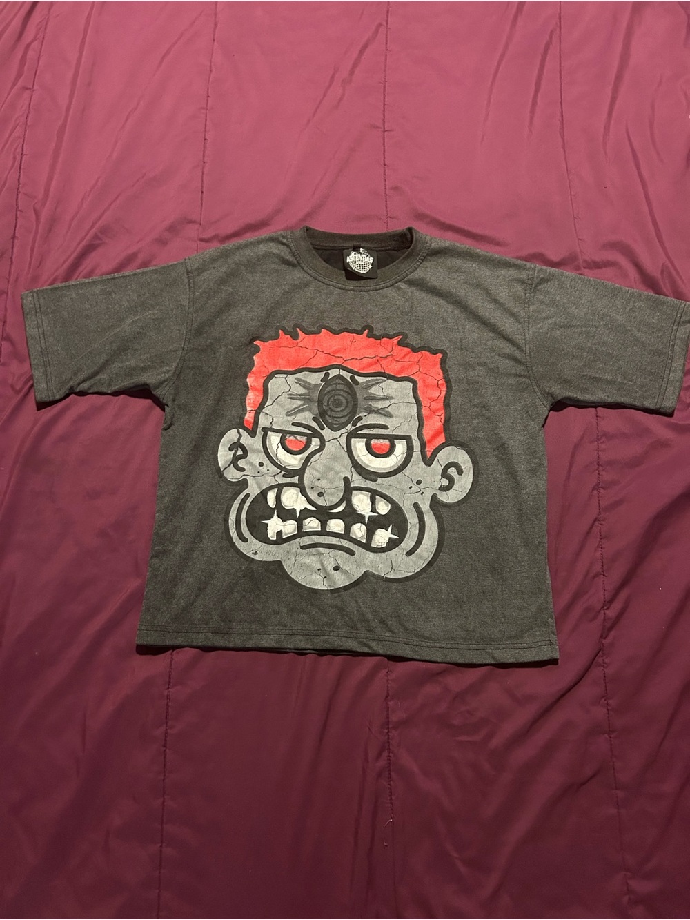 Medium sized Graphic Tee with Red-Accented Cartoon Face